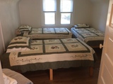 Upstairs bedroom with three twin beds